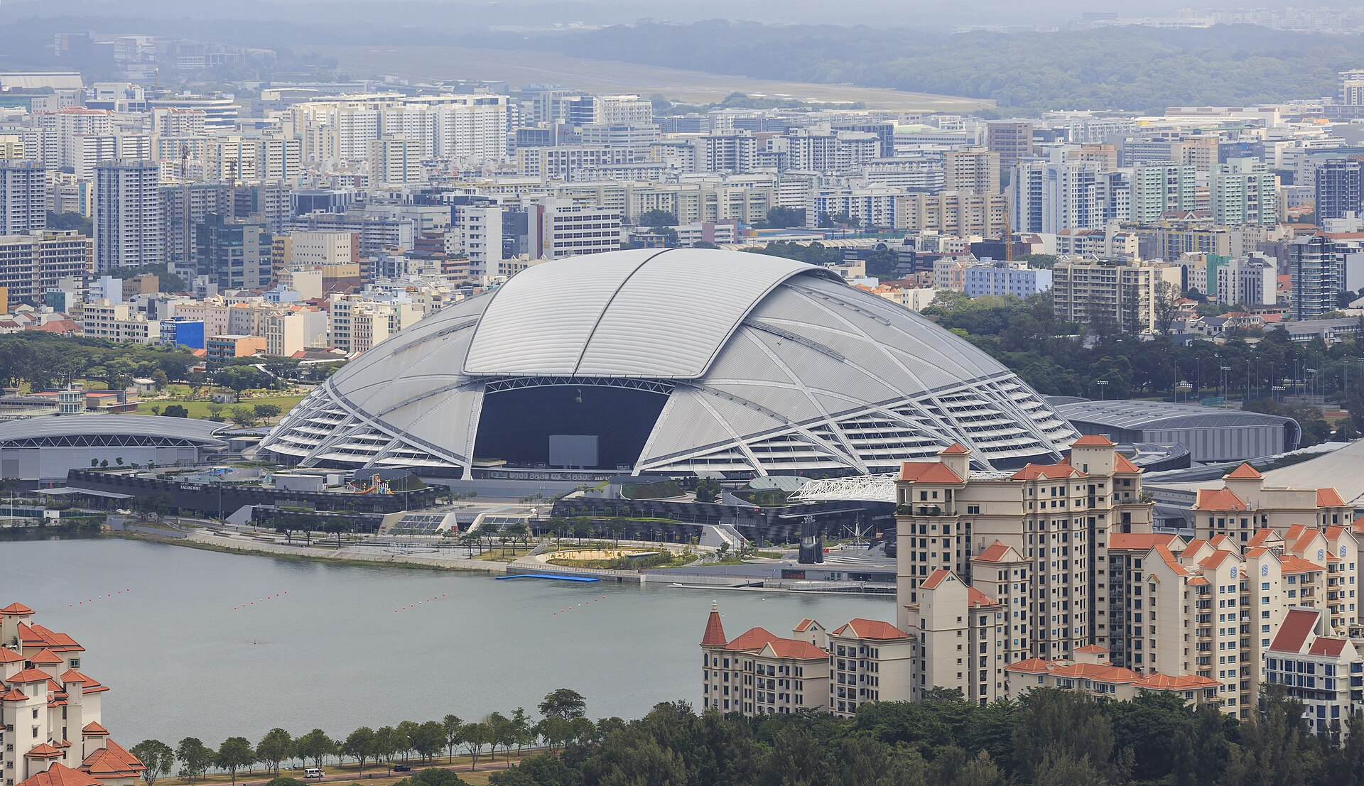 The domed National Stadium and The Kallang beside the Kallang Basin, seen from above